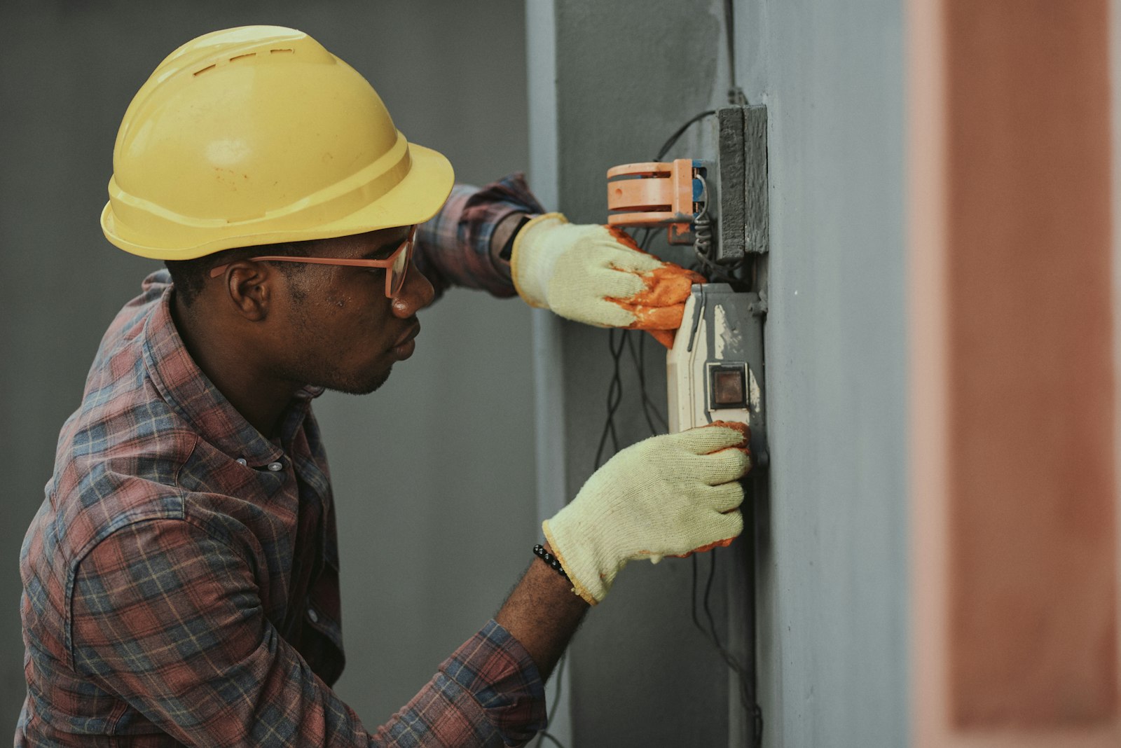 Electrician working on a wall unit